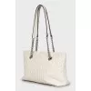 Quilted leather bag with handles