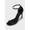 Black leather stiletto heeled sandals