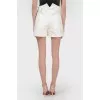 Mini shorts at a high waist with a tag