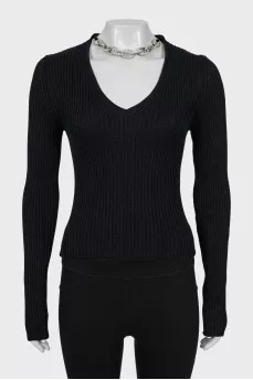 Pullover decorated with a chain with crystals