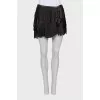 Leather mini skirt with fringe
