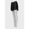 Leather mini skirt with fringe