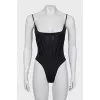 One-piece swimsuit with tag