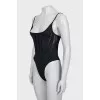 One-piece swimsuit with tag