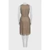 Pleated dress decorated with feathers