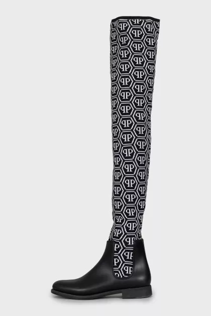 Black and white textile over the knee boots