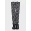 Black and white textile over the knee boots