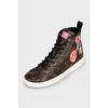 Sneakers with branded print patches
