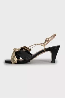 Leather sandals with golden bows