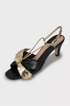Leather sandals with golden bows