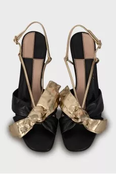 Leather sandals with golden bows