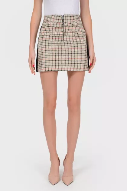 Mini-skirt in a cage with stripes