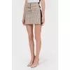 Mini-skirt in a cage with stripes
