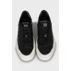 Leather sneakers with brand logo