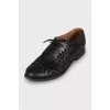 Leather brogues with shaped cutouts