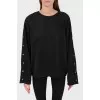Black sweatshirt with buttons on the sleeves