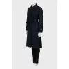 Trench coat with pleats