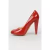 Red patent leather shoes with stiletto heels