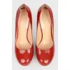 Red patent leather shoes with stiletto heels