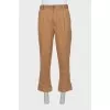 Men's trousers with buttons at the bottom