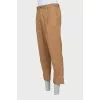 Men's trousers with buttons at the bottom