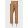 Men's trousers with buttons at the bottom