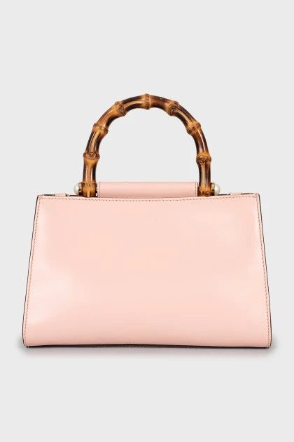 Leather bag with bamboo handle