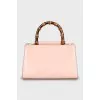 Leather bag with bamboo handle
