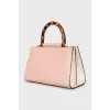 Leather bag with bamboo handle