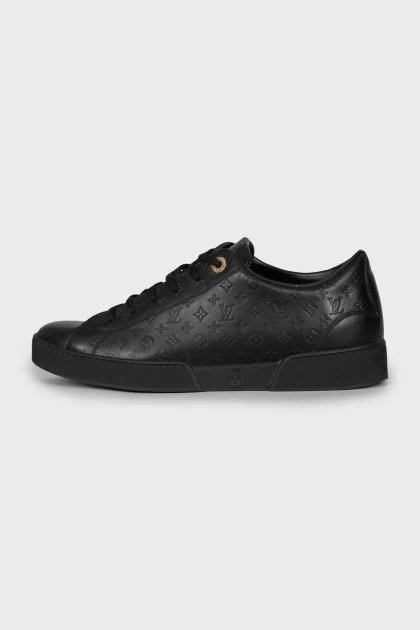 Black sneakers with branded embossing