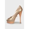 Gold patent leather shoes