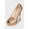 Gold patent leather shoes