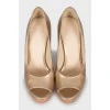 Gold patent leather shoes