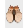 Gold patent leather shoes