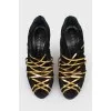 Sucks with golden leather weave