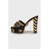 Leather mules with gold-tone heel decor