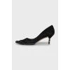 Suede pumps with a figured heel