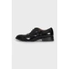 Black leather shoes with almond toe