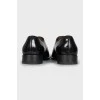 Black leather shoes with almond toe