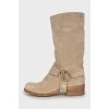 Suede boots with branded decor