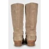 Suede boots with branded decor