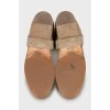 Suede boots with branded decor