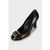 Leather shoes with branded decor