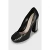 Leather shoes with decor on the heels