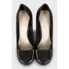 Leather shoes with decor on the heels
