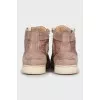 High top sneakers decorated with rhinestones