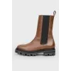 Brown Chelsea on a black sole with a tag