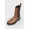 Brown Chelsea on a black sole with a tag