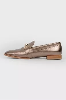Gold colored loafers