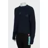 Jumper with branded embroidery and tag